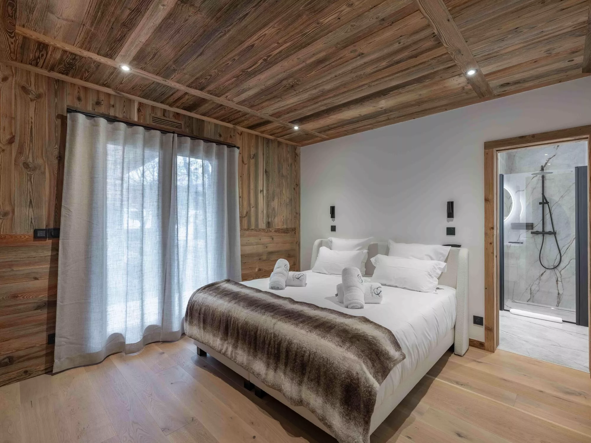 Bedroom with natural light and ensuite shower